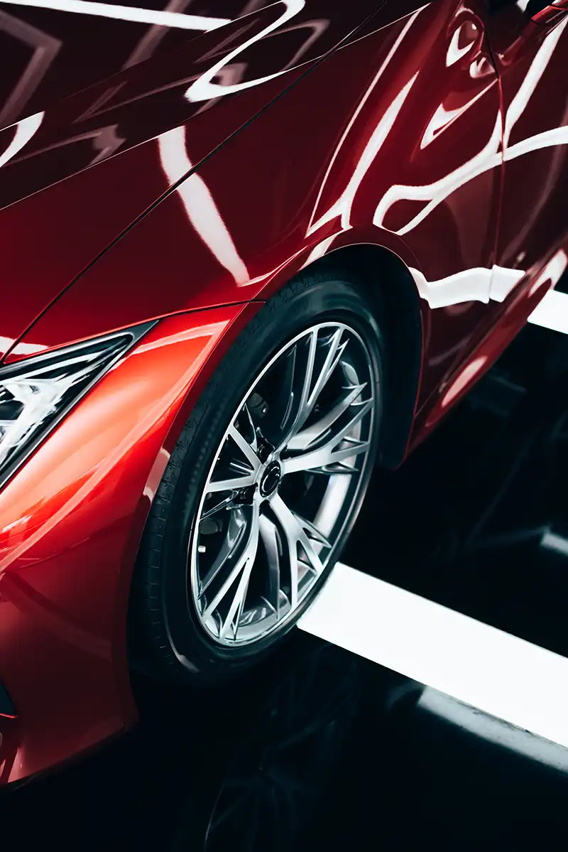 new-shiny-red-automobile-with-metallic-wheel